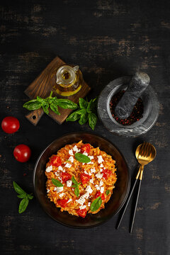 Traditional Greek Orzo Pasta with Tomato Sauce and Feta Cheese. Top view