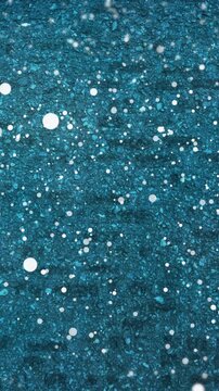 Animation of snow falling over blue surface