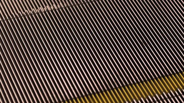 Close-up of the texture of a moving escalator.