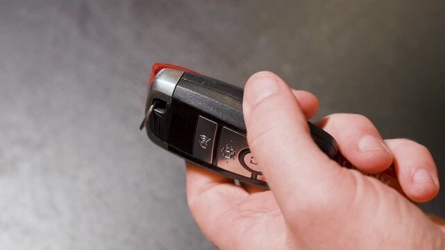 Hooking up a key fob onto a key chain.