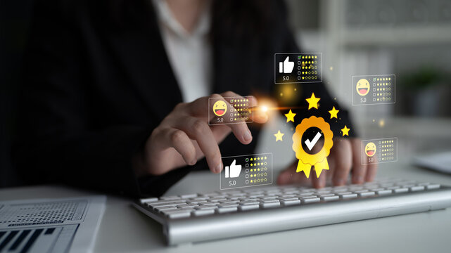 Business professional receiving positive feedback and recognition while typing on a keyboard, showcasing online reviews and rating system in a modern office setting. Entropy.
