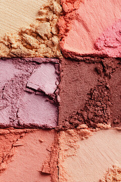 Make up palette showing colorful eyeshadow and blush powder textures, beauty cosmetics product background