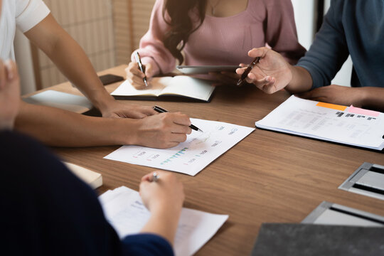 Accountant reviewing numbers in office documents for valuation clarity