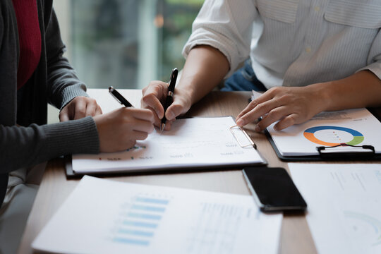 Accountant reviewing numbers in office documents for valuation clarity