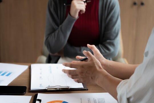 Accountant reviewing numbers in office documents for valuation clarity