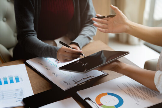 Accountant reviewing numbers in office documents for valuation clarity