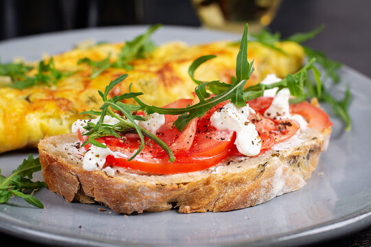 Healthy Breakfast with Omelette and Tomato Feta Toast