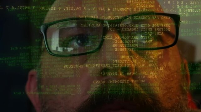 Man wearing glasses searching lines of code and data scanning displayed on front of his face