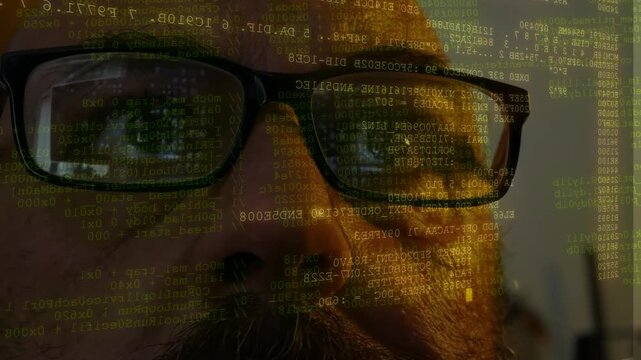 Man wearing glasses watching lines of coding and data scanning displayed on front of his face
