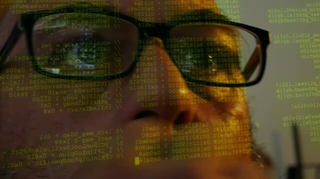 Man wearing glasses watching lines of code and data research displayed on front of his face