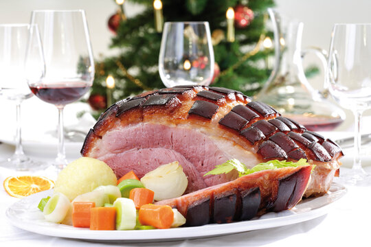 Roast Pork with Crackling, potato dumplings and vegetable on plate