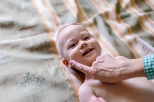 Portrait of happy toddler with his mother