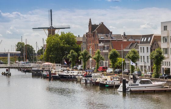 Historic Distilleerketel windmill at the harbor in Delfshaven, Rotterdam, Netherlands
