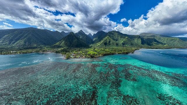 Aerial view of Tahiti Iti coast with turquoise water and mountains