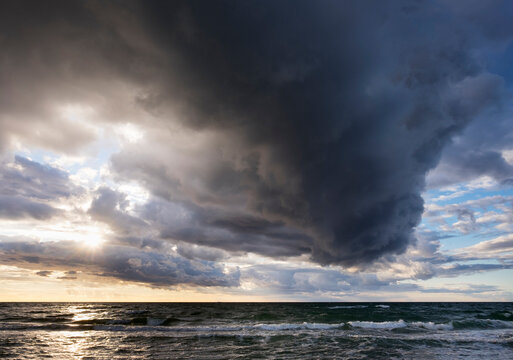 Germany, Mecklenburg-Western Pomerania, rain clouds over Baltic Sea