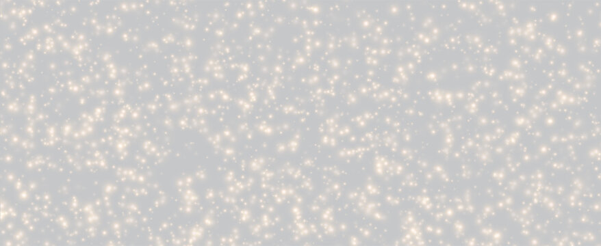 Soft Golden Glitter and Glowing Particles on Light Gray Background