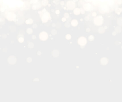 Glowing White Bokeh Lights on Soft Beige Background with Empty Space