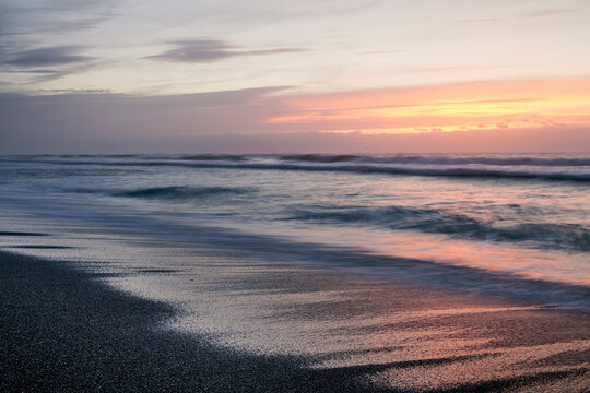 New Zealand, South Island, Punakaiki, sunset over beach