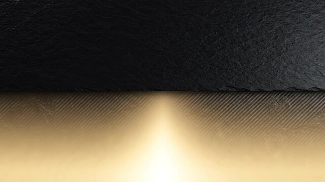 Textured carbon fiber surface emerging from dark slate background with warm glowing golden cinematic light motion video clip project background