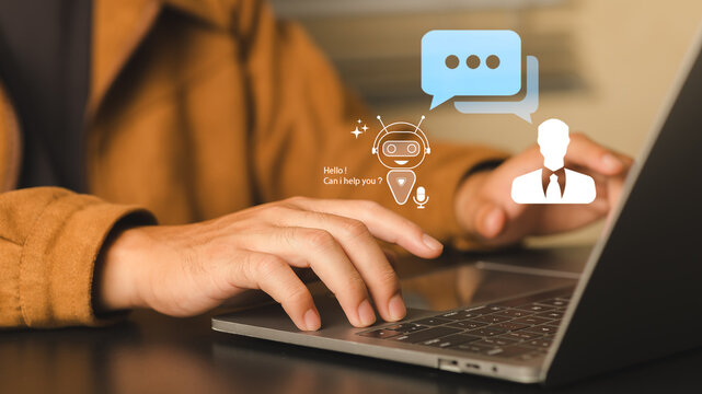 Businessperson Using Laptop with Virtual Assistance and Chatbot Graphics