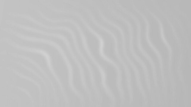 Abstract wavy line texture gently flows and undulates across a soft gray background as seamless minimalist motion graphics