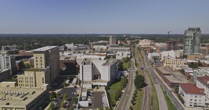 Durham North Carolina Aerial v24 flyover across rail lines and downtown toward Central Park and the Warehouse District - Shot with Mavic 3 Pro Cine - Oct 1st 2023