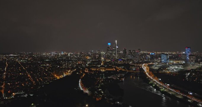 Philadelphia Pennsylvania Aerial v138 reverse nighttime flyover above the Schuylkill River parks toward University City and Center City - Shot with Inspire 3 8k - Sept 28th 2023