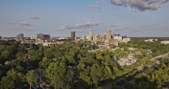 Raleigh North Carolina Aerial v66 low flyover from Dorothea Dix Park across the Warehouse District toward downtown during golden hour - Shot with Mavic 3 Pro Cine - Sept 30th 2023