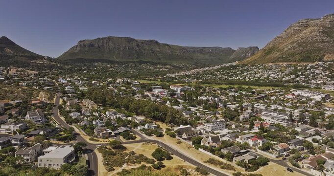 Cape Town South Africa Aerial v94 flyover above Hout Bay hillside neighborhoods, Penzance and Scott Estate beneath coastal mountains - Shot with Mavic 3 Pro Cine - Jan 11th 2024