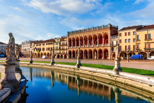 beautiful city view of an urban landscape with park chanel with blue water and monuments and historic european buildings on background. Autumn season city landscape