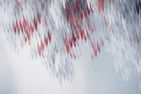 Abstract vertical motion blur background featuring red white and grey streaks with grain
