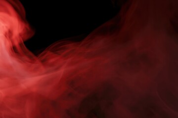 Fototapeta premium The Red Smoke Abstractly Dancing Through Darkness Creating Dramatic Cinematic Atmosphere