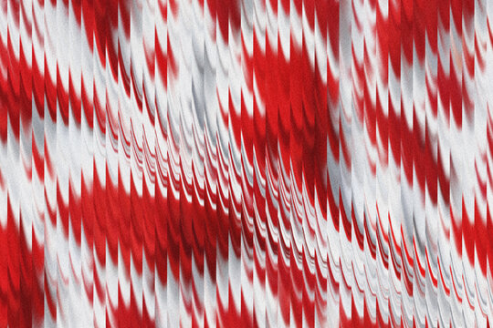 Abstract red and white vertical striped pattern with grainy texture and motion blur effect