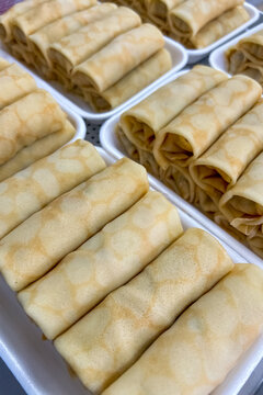 Freshly Crepes filled semi-finished products ready for further cooking processes in a food production space