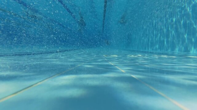 Man Swimming Underwater with Mask and Snorkel in Pool