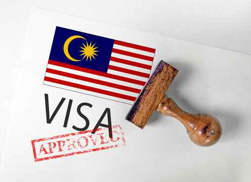 Malaysia Visa Approved with Rubber Stamp and flag
