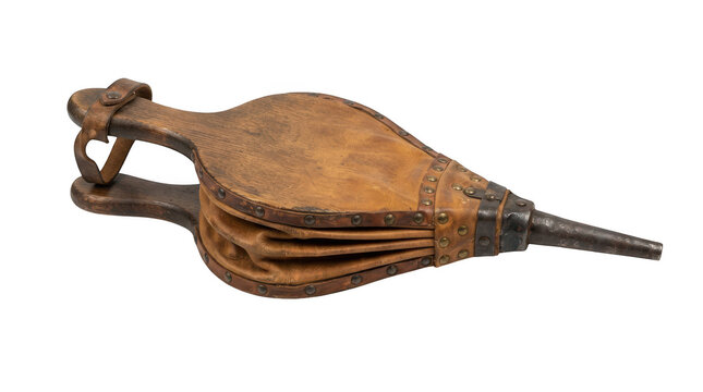 Antique fireplace bellows made of wood and leather isolated on transparent background