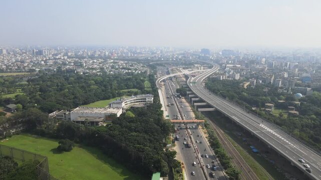 Vehicles Traveling on Elevated Flyover Through Dhaka City