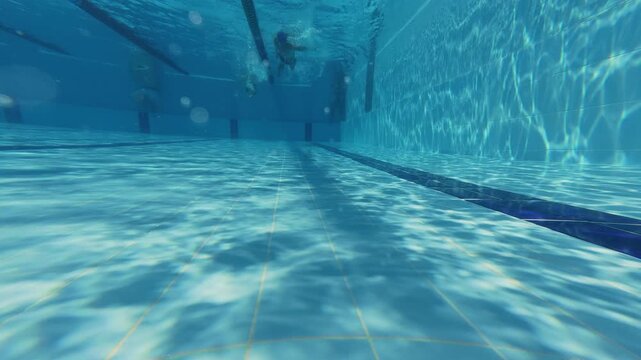 Underwater View of Swimming Pool Lanes with Swimmers
