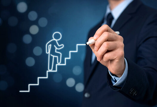 Business professional drawing a stick figure climbing stairs as a success and career growth concept