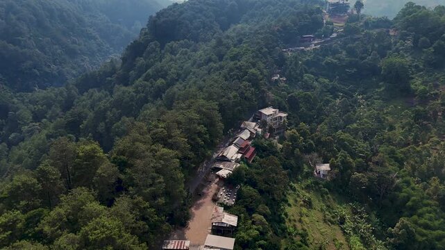Description
Green urban forest area in Dago, Bandung, West Java, Indonesia, featuring lush vegetation and a natural environment within the city.