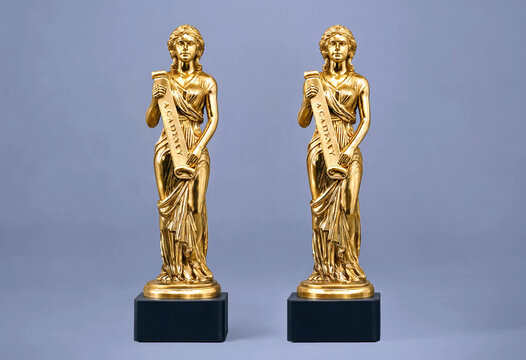 Elegant pair of golden statues holding scrolls standing on black bases perfect for awards or decorations