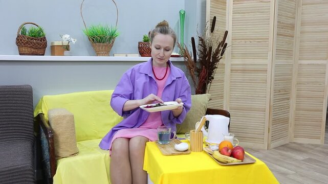 A woman inhales the aroma of different types of herbal tea