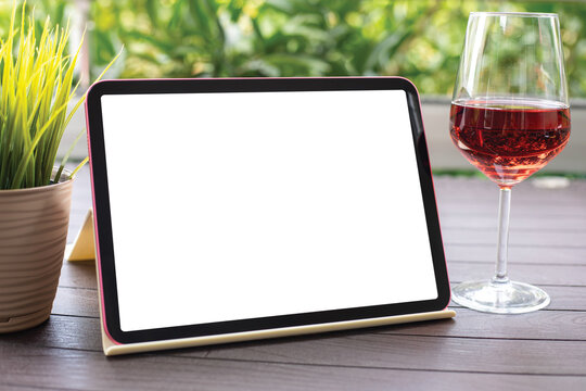 Computer tablet with isolated screen background table glass wine cafe
