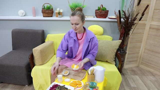 Woman pouring oat milk into a bowl of cottage cheese