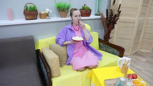 woman eating popcorn