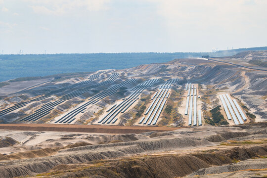 Hambach open pit mine operation area, mining lignite with solar panel photovoltaic modules, change to renewable sustainable energy