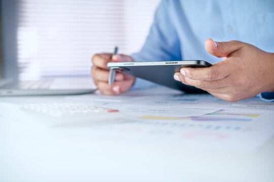 Business Finance Planning with Tablet and Financial Documents for Digital Budget Management, Investment Strategy, Accounting Analysis, and Professional Decision Making, calculate and investment