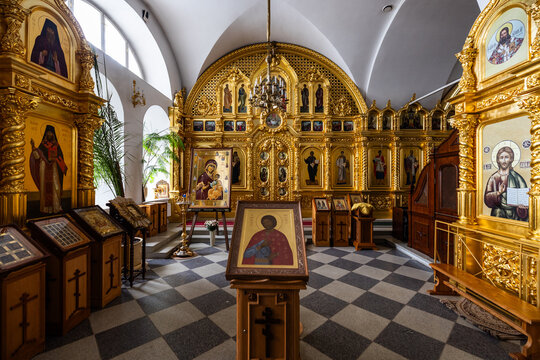 View of the ornate golden iconostasis and religious icons inside the historic Solovetsky Monastery in Solovetsky, Arkhangelsk Oblast, Russia.