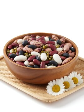 A beautifully composed still life capturing a vibrant "harvest of colors" with a rich assortment of mixed dried beans&mdash;including kidney, pinto, black, white, and mung beans&mdash;overflowing from a smooth 